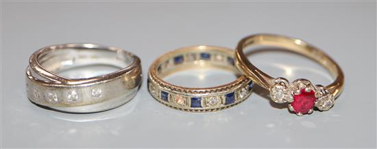 Three assorted 9ct gold and gem set rings.